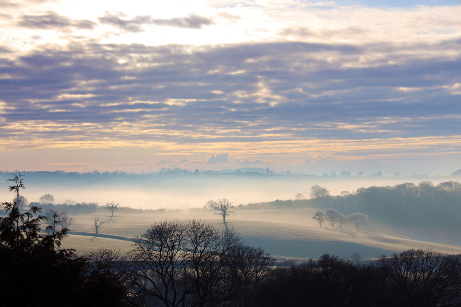 Landscape view across farmland to Munderfield from Bromyard Downs, Herefordshire. 