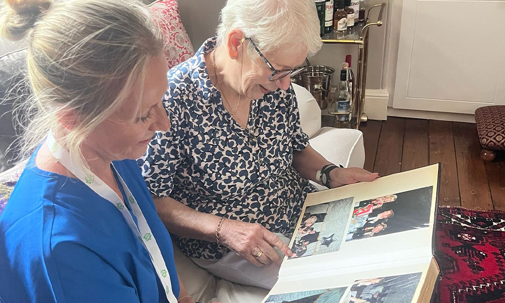 Two women looking through a photo album together